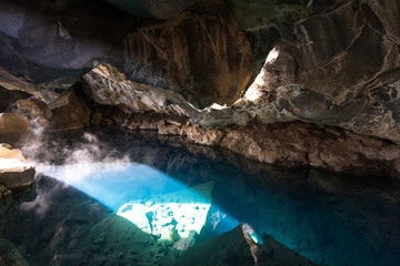cave with blue geothermal water in myvatn, Volcanic cave Grjotagja, iceland