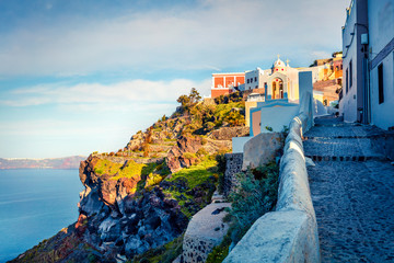 Sunny morning view of Santorini island. Picturesque spring scene of the famous Greek resort Fira,...