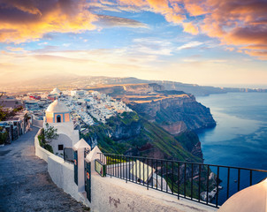 Dramatic morning view of Santorini island. Picturesque spring sunrise on the famous Greek resort Fira, Greece, Europe. Traveling concept background. Artistic style post processed photo.