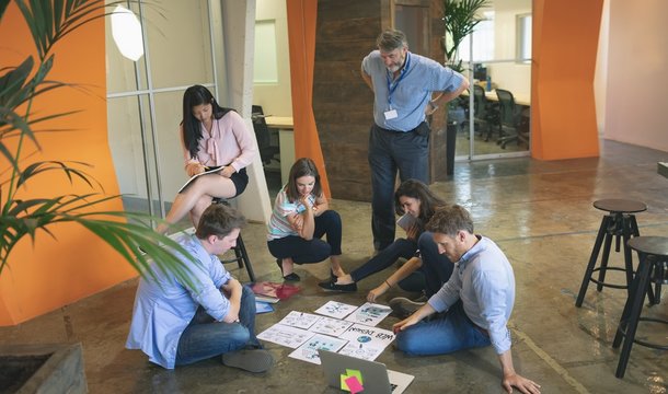 Business people discussing over documents
