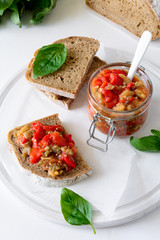 Rye bread toasts and glass jar with eggplant caviar. Vegetable appetizer or antipasti. Healthy food concept