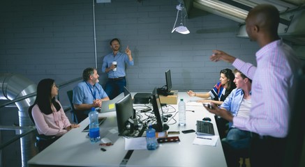 Business people interacting with each other