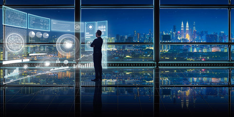 Smart financial analytics working at modern office with big data ,connections icon, internet of things, financial charts and graph virtual screen.