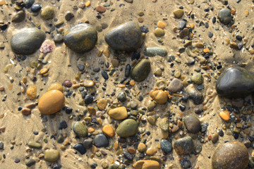 Stone in beach sand