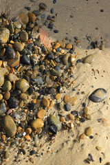 Stone in beach sand