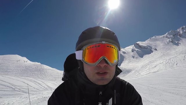 Selfie Portait Skier Accelerates Quickly Downhill Skiing In Winter Mountains