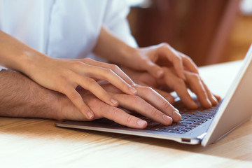 Young couple having romantic evening at home woman reading book