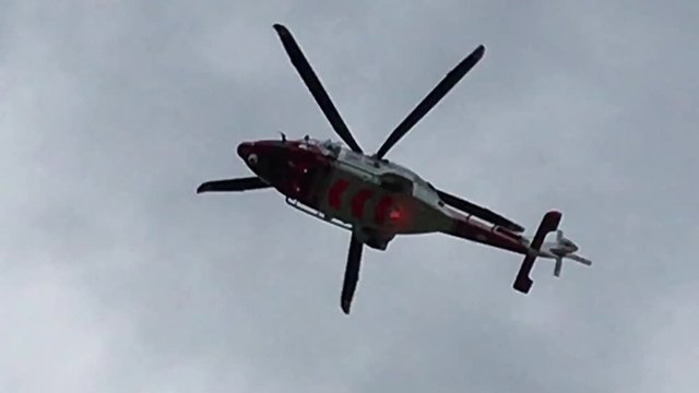 HM Coastguard hovering above