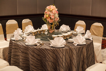 hotel restaurant venue, food catering service buffet or cocktail banquet for wedding ceremonies, seminars, meetings, conferences, parties or events. VIP dining table with cutlery and napkin settings.