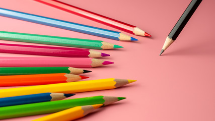 Pencil stand on pink paper background. - Business concept.