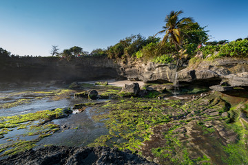 sunset an temple pura tanah lot at bali indonesia while ebb