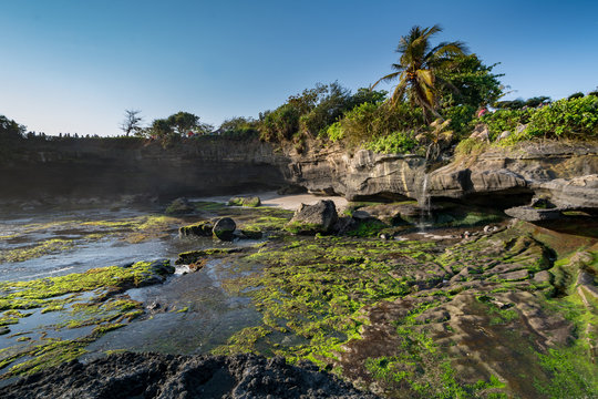 sunset an temple pura tanah lot at bali indonesia while ebb