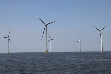 Modern wind turbines in the Noordoostpolder in the Netherlands for sustainable electricity