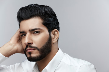 Obraz premium Fashion Man Portrait. Male Model With Hair Style And Beard