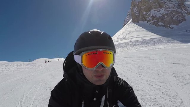 Selfie Portrait Of A Skier Quickly Accelerates Skiing In The Mountains In Winter