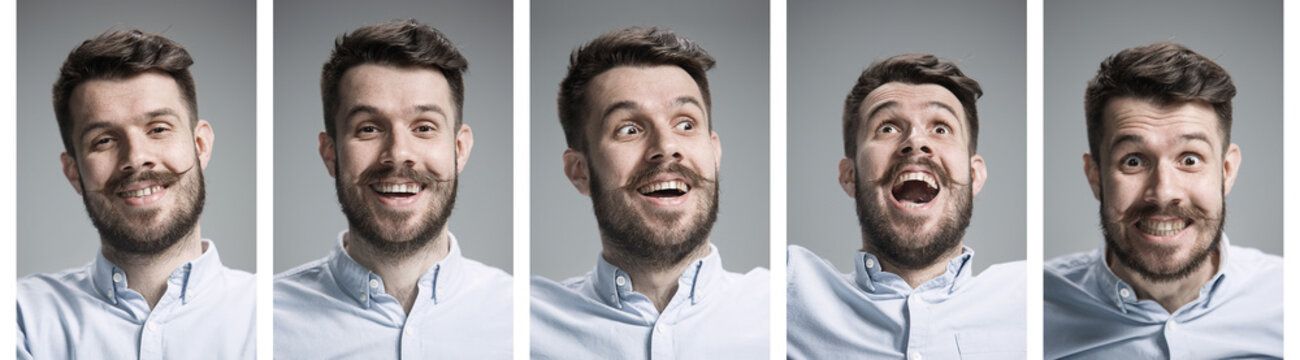 Set of young man's portraits with different happy emotions on gray studio background