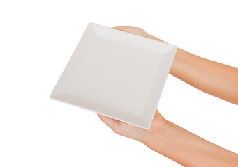 Blank white square matte plate in female hand. perspective view, isolated on white background