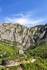Fototapeta na wymiar Small hermitage on the middle of the mountain of Montserrat