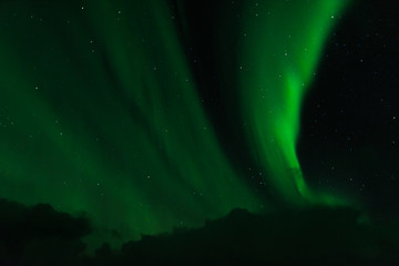 norwegian aurora borealis with mountains and water, view from hurtigruten ship boat, norway, europe, green northern lights