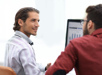 smiling employee talking with a colleague