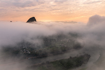 Mountain Peaks in Cloudy Sunrise Foggy Landscape Yangshuo
