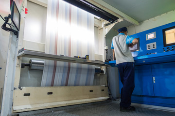 Employee Working at Printing Equipment Factory Industrial Setting
