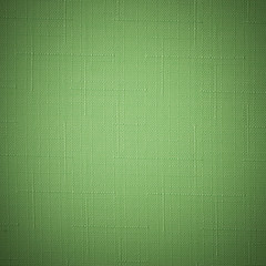 Fototapeta premium Green fabric background. 