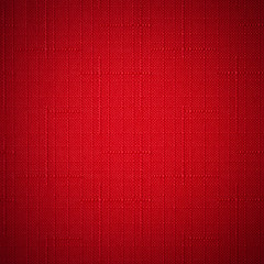 Red fabric background.
