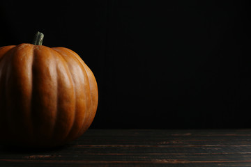 Pumpkin on a dark background, chelow. Copy space. © Plutmaverick