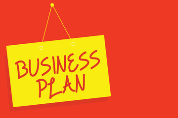 Handwriting text writing Business Plan. Concept meaning Structural Strategy Goals and Objectives Financial Projections Yellow board wall message communication open close sign red background