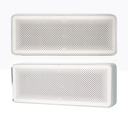 Wireless speaker isolated on white background. Front and side view.