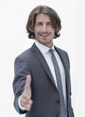 Businessman offering handshake to you on white background
