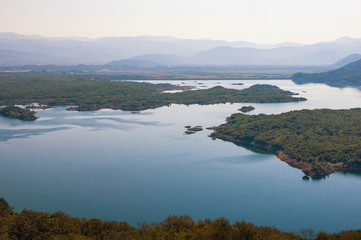Beautiful summer landscape with a picturesque lake and many small islands. Montenegro, view of Salt Lake near town of Niksic