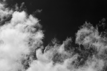 Obraz premium Clouds over black.