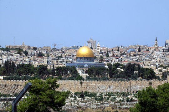 view of the old city of Jerusalem in Israel with an olive mountain. the golden dome of the Moslem mosque