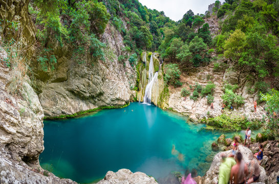 Natural waterfall and lake in Polilimnio area in Greece. Polimnio is a complex of waterfalls and lakes are located near Charavgi Municipality, Messinia prefecture, Peloponnese, Greece.