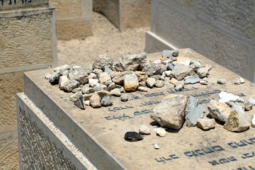Tombstones of the grave. Jewish cemetery on the Mount of Olives close up. The symbol of death and...