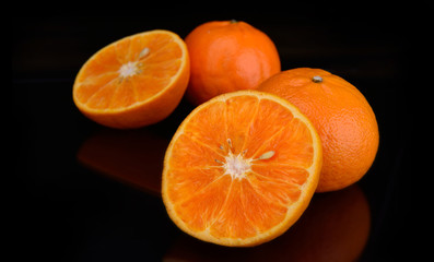 Orange fruit  in black background.