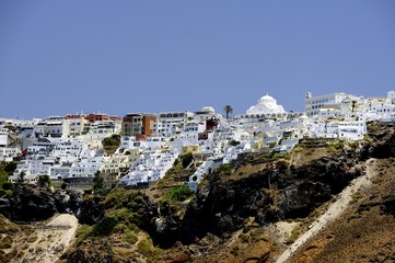 White houses clinging to the cliff tops