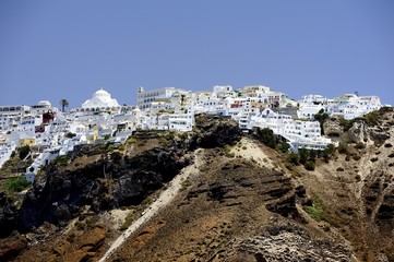 White houses clinging to the cliff tops