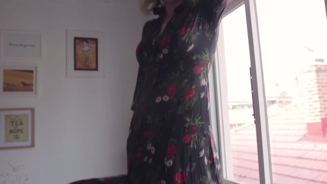 Lady in a dress dancing on a table