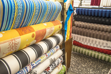 Traditional fabric store with stacks of colorful textiles, in Sao Paulo