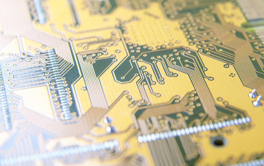 printed circuit board close-up, contact tracks of electronics with bokeh, line of electro communication