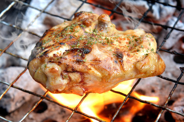 Chicken grill steak with charcoal fire