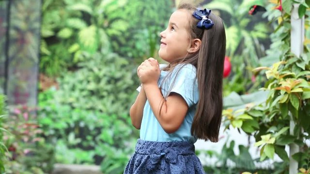 Little girl with butterfly on hand