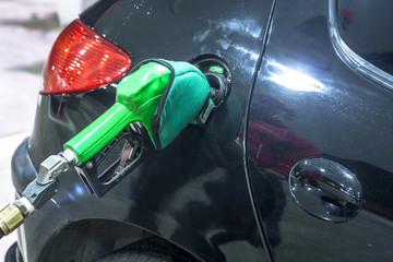 Sao Paulo, Brazil, November 15, 2011. detail of a car being fueled with ethanol in a gas station in Sao Paulo