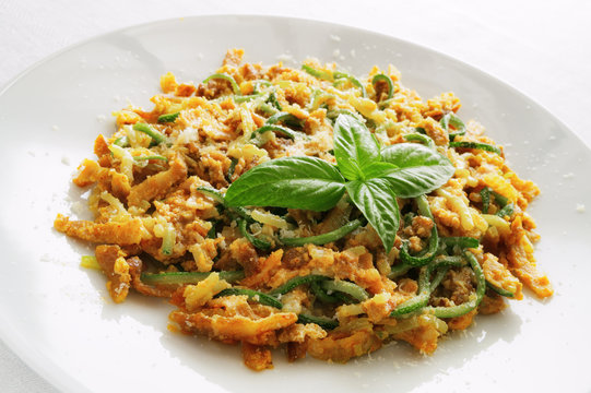 Zucchini Spaghetti Carbonara Decorated With Basil Leafs