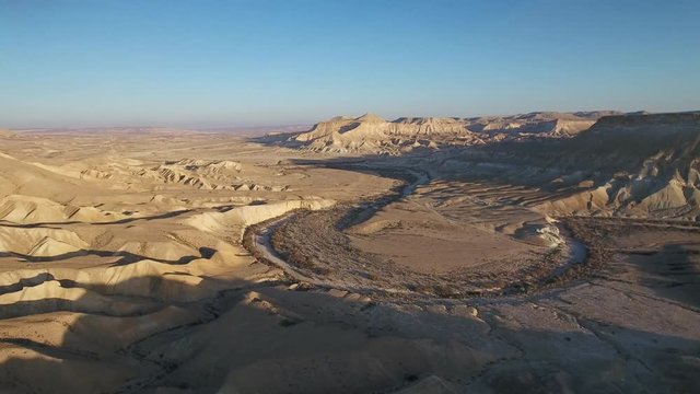 Aerial footage at Sde Boker, in Neguev desert of Israel. Dry river in the desert landscape.