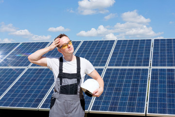 Solar panels engineer with white cask