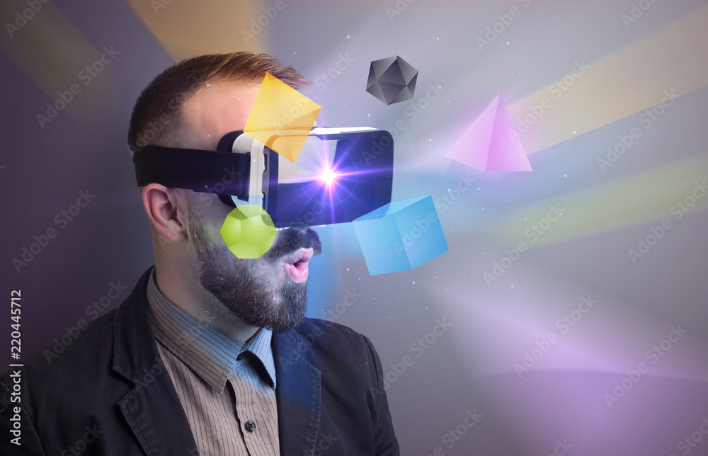 Poster amazed businessman with virtual reality colorful geometric shapes in front of him